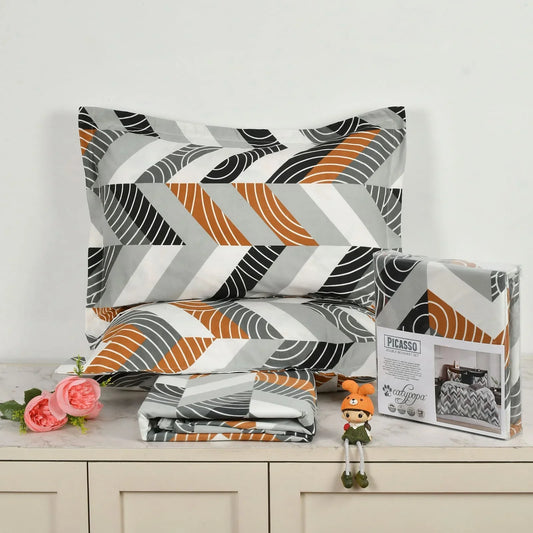 Abstract wave pattern bedsheet set in orange, grey, black and white geometric design - Picasso collection 3PC cotton bedding set with modern art pattern by Towelleo.com displayed on white dresser with decorative flowers and packaging
