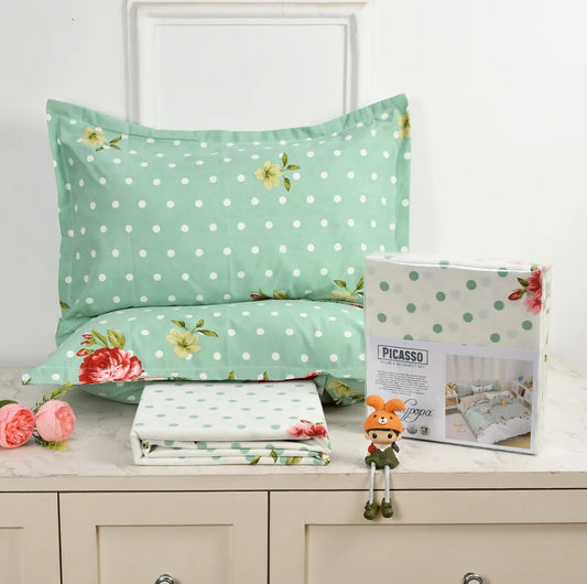Mint green bedsheet set with white polka dots and colorful floral accents - Picasso collection 3PC cotton bedding set with vintage style design by Towelleo.com displayed on white dresser with decorative flowers and packaging
