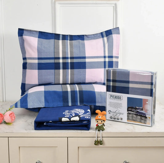 Navy blue and pink plaid checkered bedsheet set with white stripes - Picasso collection 3PC cotton bedding set with tartan design by Towelleo.com displayed on white dresser with decorative flowers and packaging
