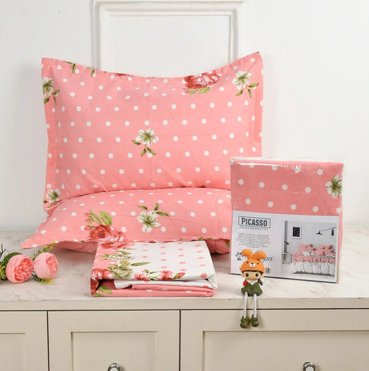 Pink floral bedsheet set with white polka dots and rose pattern - Picasso collection 3PC cotton bedding set with pillow covers by Towelleo.com displayed on white dresser with decorative flowers and packaging

