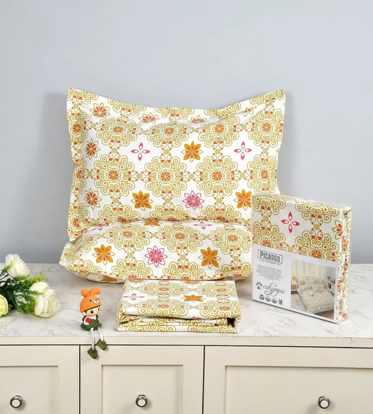 Traditional mandala bedsheet set with gold ornate pattern and colorful floral motifs - Picasso collection 3PC cotton bedding set by Towelleo.com displayed on white dresser with decorative flowers and packaging
