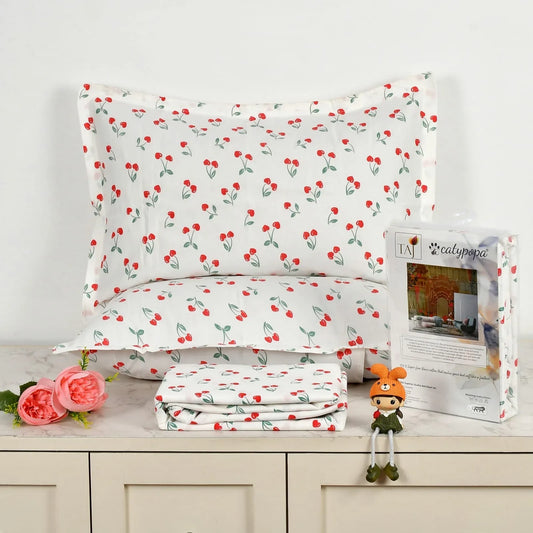 TAJ Collection cherry blossom cotton bedsheet set with red cherries and green leaves on white background - double bed size with matching pillow covers and premium packaging