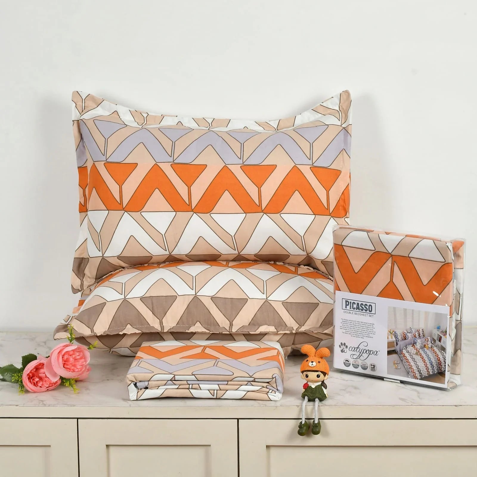 Picasso Orange Geometric 3PC Bedsheet Set - Double Bed Setup in Modern Bedroom - Orange Beige White Triangular Patterns - Glace Cotton 180 TC by CATYPOPA towelleo.
om