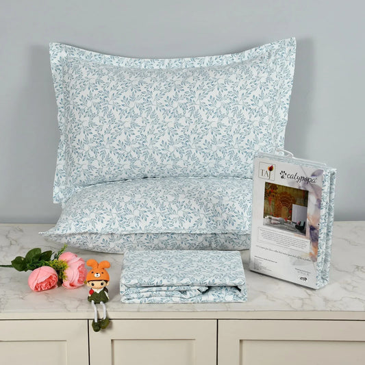TAJ Collection double bedsheet set with blue leaf pattern on white background, 100% imported glace cotton fabric, luxury button box packaging with matching pillow covers towelleo.com